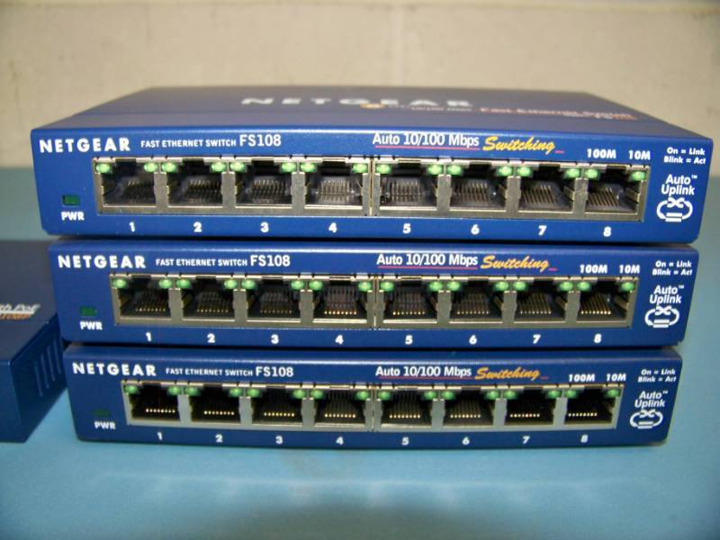 lot 120 image: (4) NetGear, 8-Port, 10100 Mbps Fast Ethernet Switches
