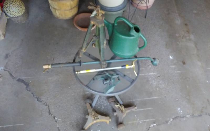 lot 16 image: Small Glass Top Patio Table, Watering Can, Watering Wand, Asst Sprinklers