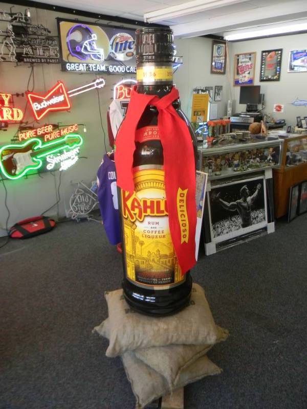 lot 31 image: VERY RARE DISPLAY KAHLUA RUM LARGE DISPLAY BOTTLE WITH SCARF - APPROX 6FT BY 16 - AWESOME DISPLAY PIECE - SEE PICTURES