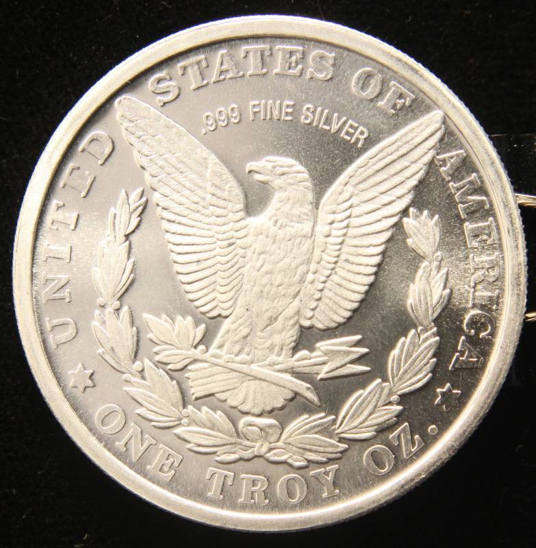 lot 13 image: 1 TROY OZ. .999 FINE SILVER MORGAN DOLLAR DESIGN