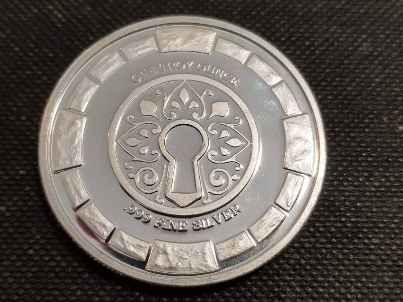 lot 06-A image: 1 TROY OZ. .999 FINE SILVER STANSBURY RESEARCH KEY ROUND