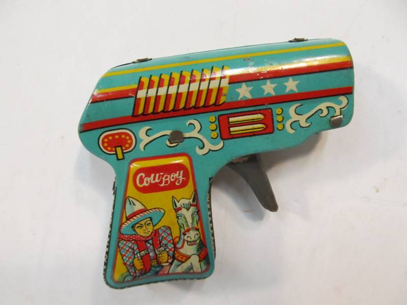 lot 129 image: Nice Clean Vintage Japanese Tin Litho Toy Friction Cowboy Gun