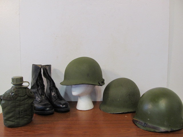 lot 246 image: Original Vietnam War M1 Helmets Boots & Canteen