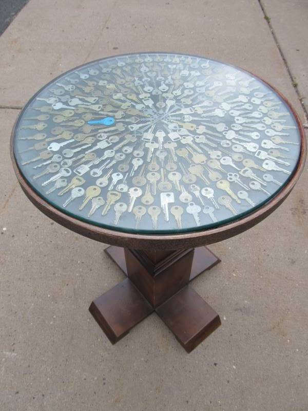 lot 263 image: Round Glass Top Cocktail Table wVintage Key Top