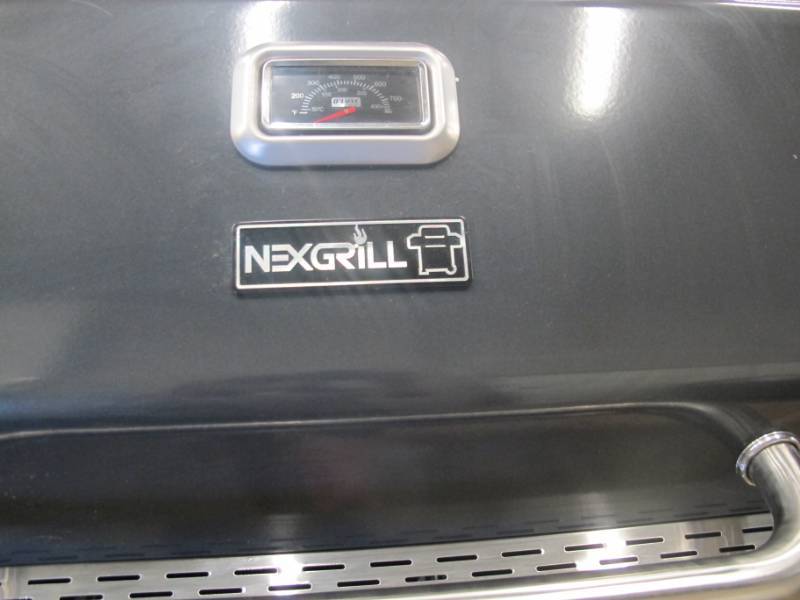 lot 30 image: Nexgrill Deluxe 6-Burner Propane Gas Grill in Slate with Ceramic Searing Side Burner -NEW - No Racks, scratch on door
