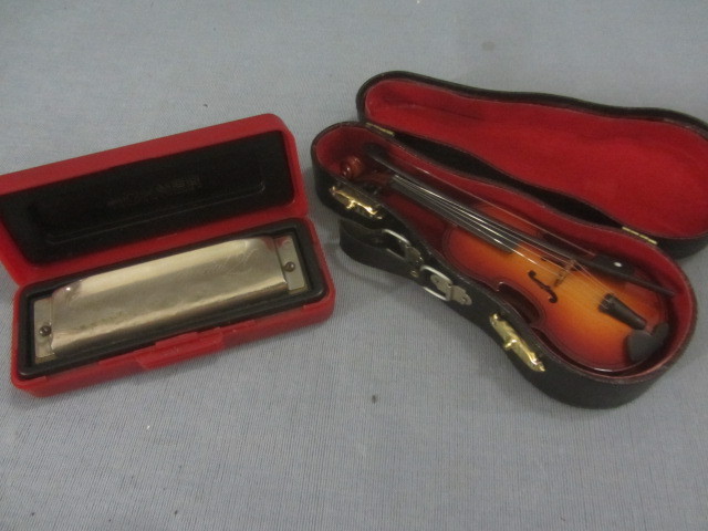 lot 105 image: Harmonica, Mini Violin