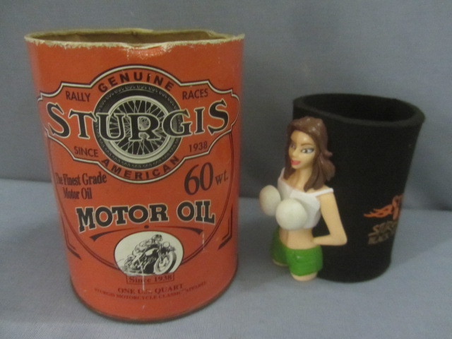 lot 85 image: Sturgis Oil Can, Bobble Babe