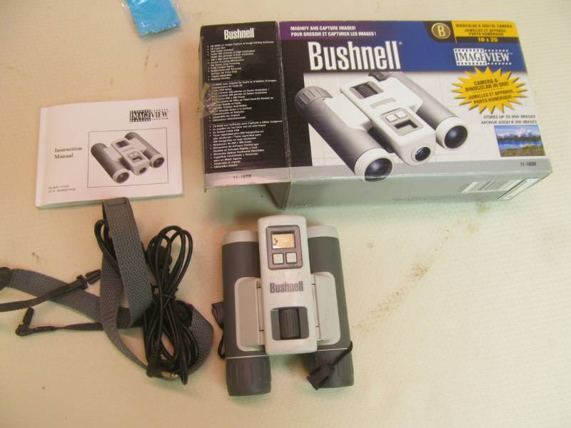 lot 87 image: Bushnell camera binoculars