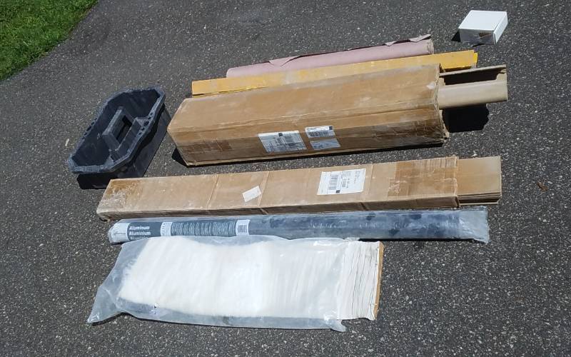 lot 92 image: Aluminum Screen, Utility Tote, Concrete Corner Guards & Other Bldg Materials