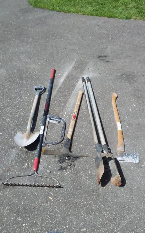 lot 98 image: Post Hole Digger, Hard Rake, Pick Ax, Other Ax, Shovel, Brush Saw