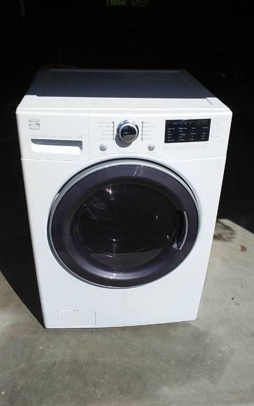 lot 134 image: Kenmore Front Load Washing Machine With Connector Hose - Works
