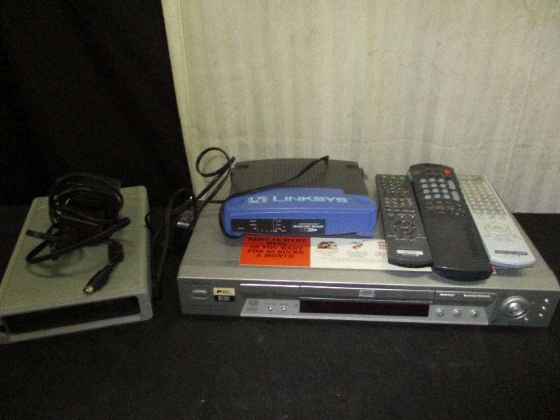 lot 82 image: DVD Players and one can be a rewriter and Lynx Intrnet Router
