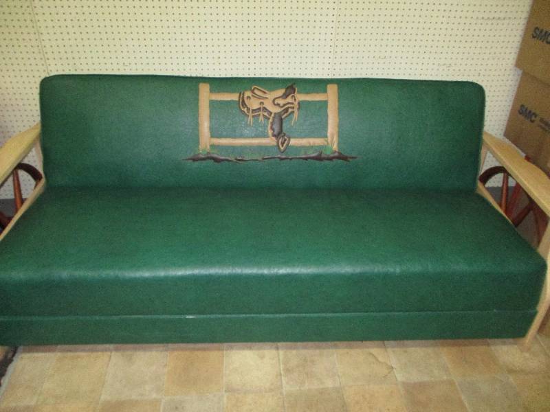 lot 110 image: Beautiful Western Couch  in Mint Condition with Saddle and Fence Folds down into a bed 7ft Long