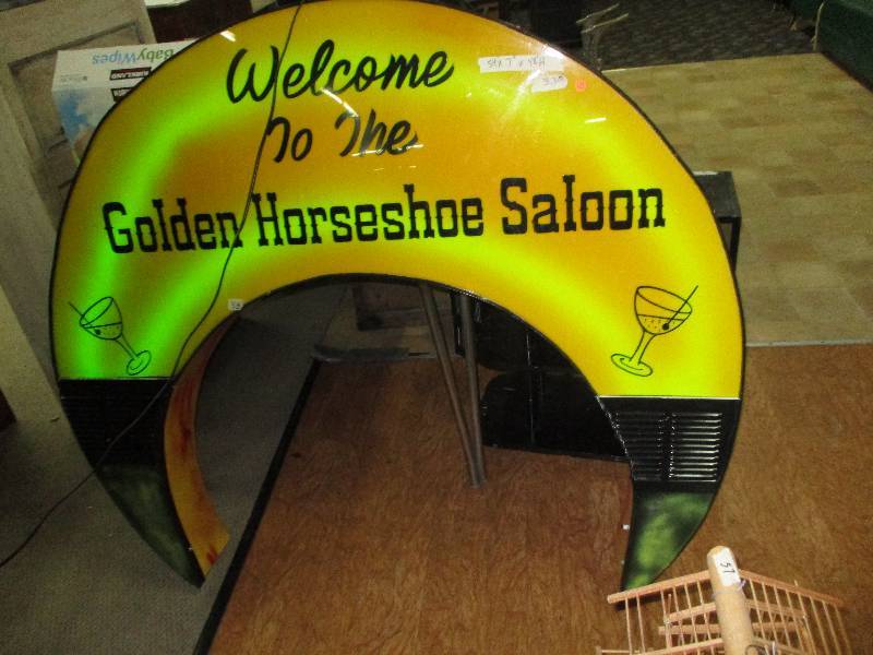 lot 115 image: Welcome to the Golden Horseshoe Saloon  Works and has remote 54x7x 48 Neon Bar Sign from 1960s Converted to Led Multi Color with Remote