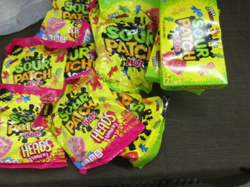 lot 18 image: 12 Sour Patch Kids Candies Items...
