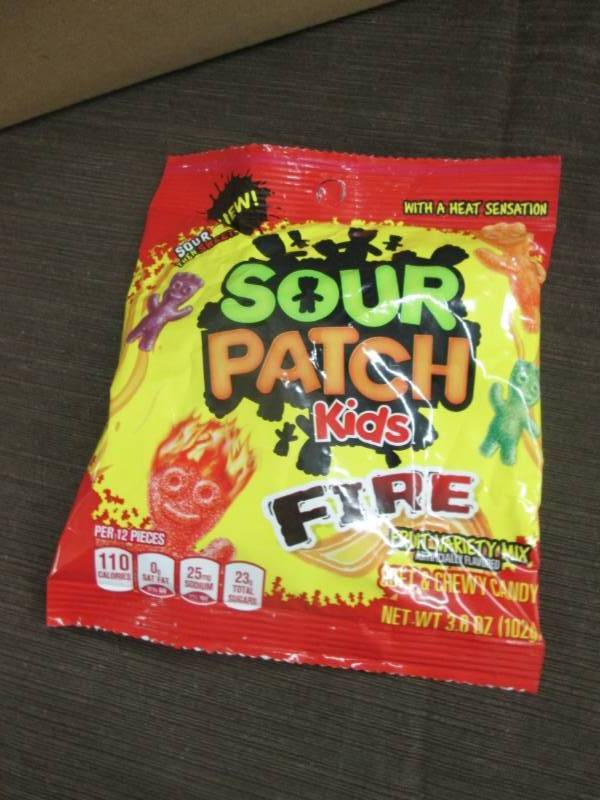 lot 83 image: Case of 12 - 3.6 oz Sour Patch Kids...