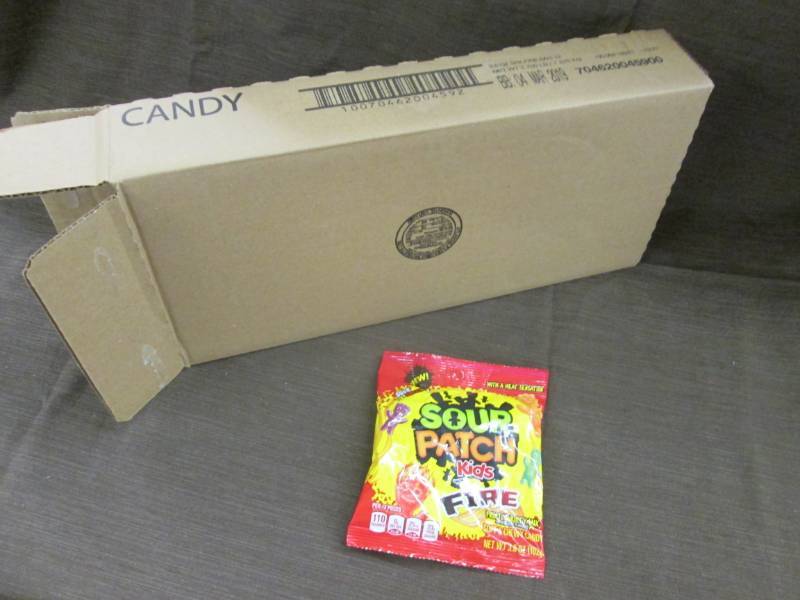 lot 86 image: Case of 12 - 3.6 oz Sour Patch Kids...