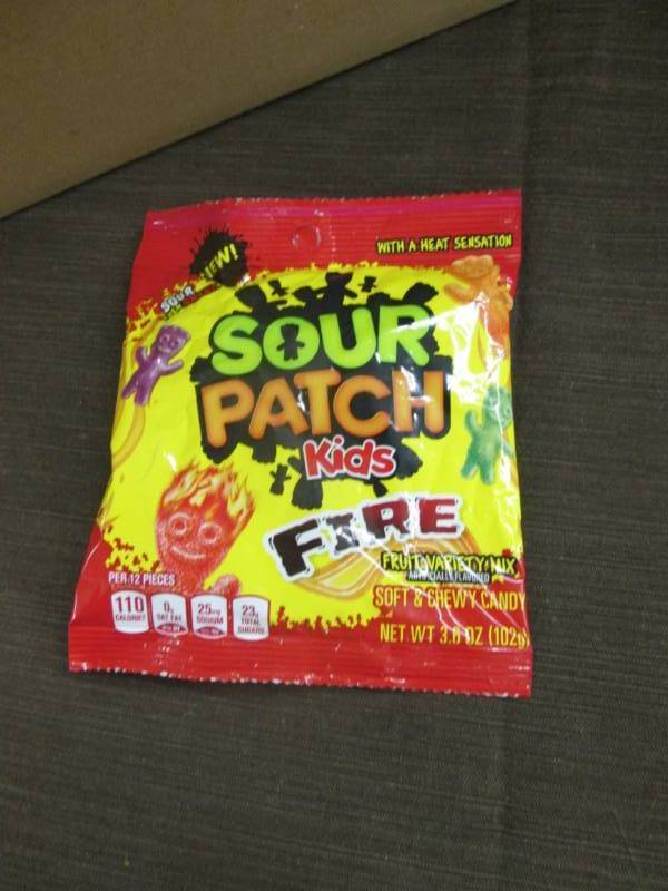 lot 92 image: Case of 12 - 3.6 oz Sour Patch Kids...