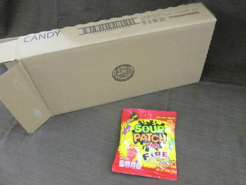lot 93 image: Case of 12 - 3.6 oz Sour Patch Kids...