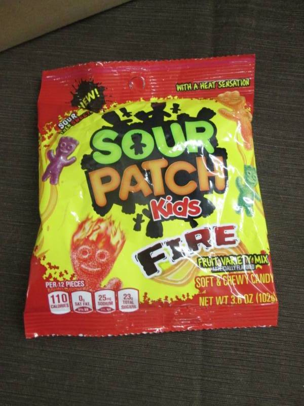 lot 94 image: Case of 12 - 3.6 oz Sour Patch Kids...