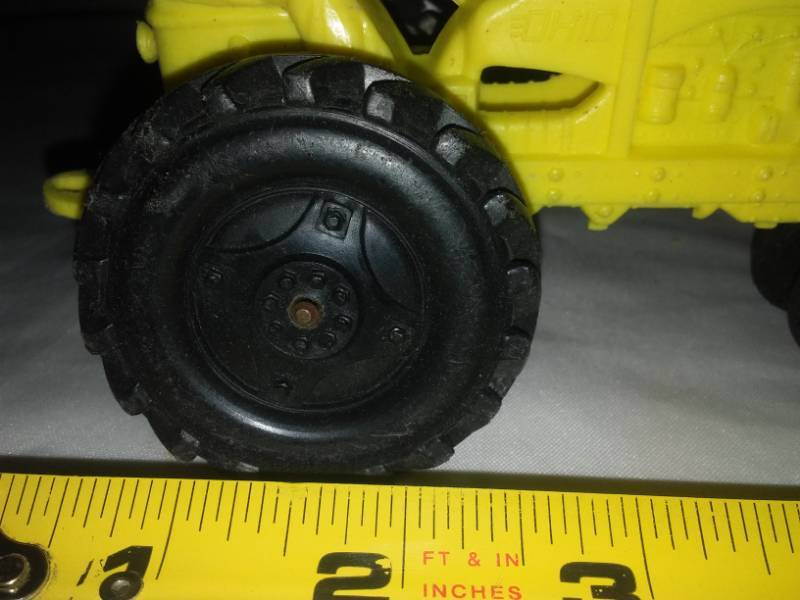 lot 18 image: Plastic tractor - goes with tin farm sets.