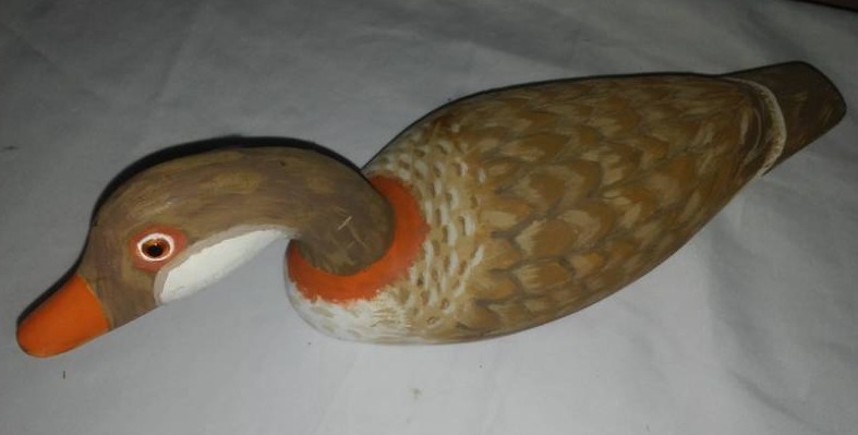 lot 24 image: Hand carved and painted wood duck decoy - great detail.