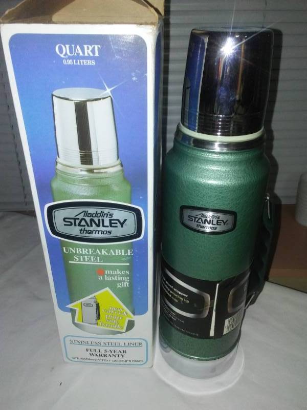 lot 27 image: New in box - Aladdin Stanley Thermos, steel. 5 year warranty.