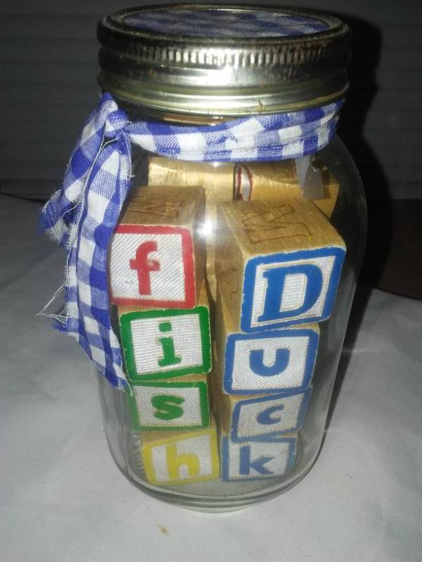 lot 29 image: Vintage wood blocks in quart jar