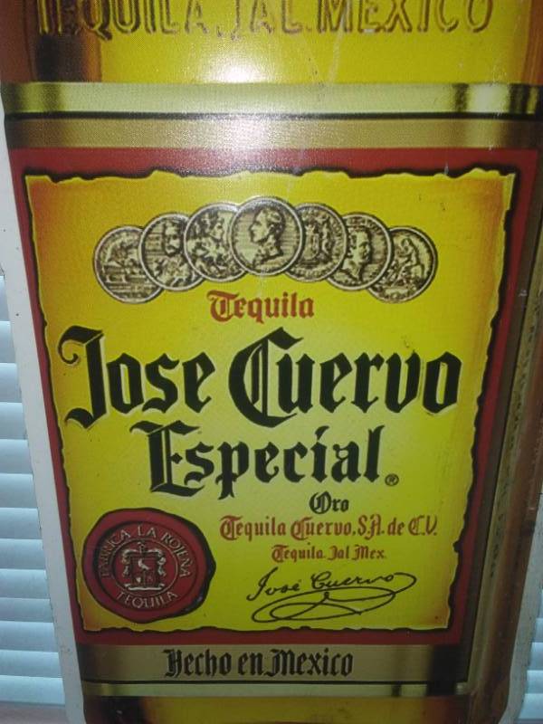 lot 37 image: Jose Cuervo metal sign, 31 in tall.
