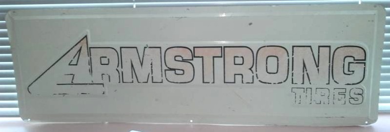 lot 38 image: Armstrong tires metal sign, 36 x 12.
