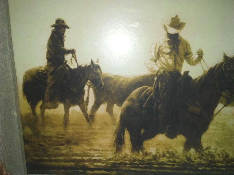 lot 65 image: Cowboy western themed art.