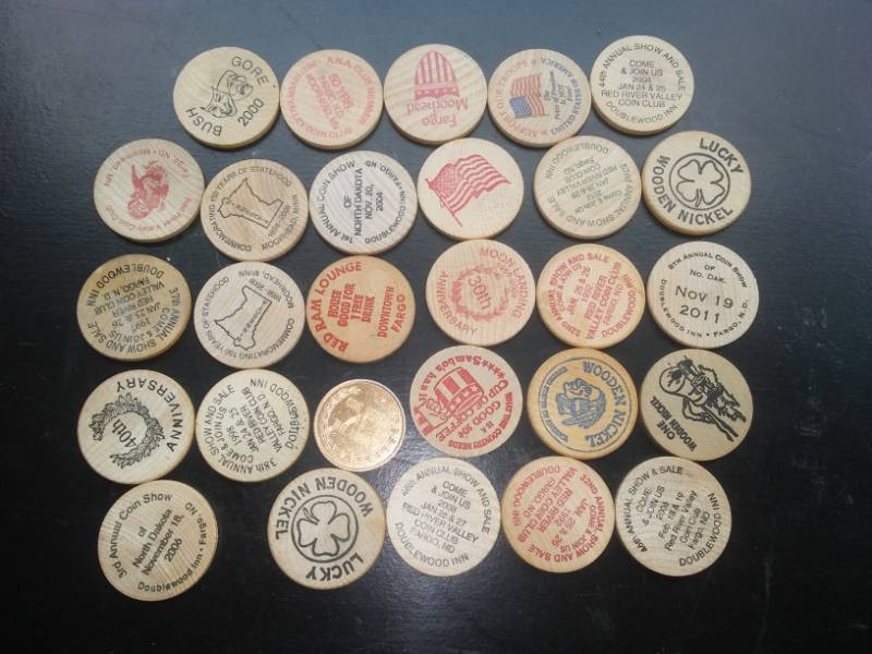lot 69 image: Collector wood discs, wooden nickels, pogs. Lewis and Clark, Sambos
