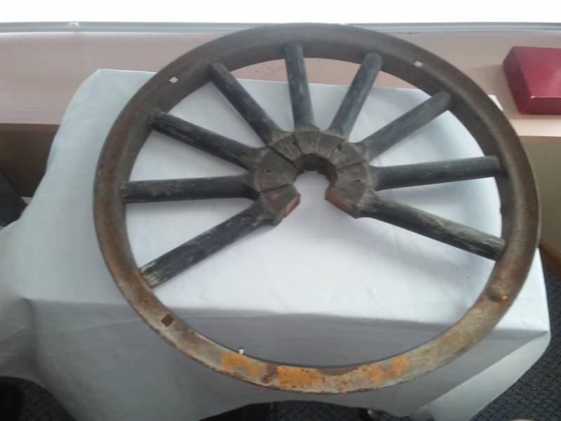 lot 100 image: Old metal wheel, wood spokes
