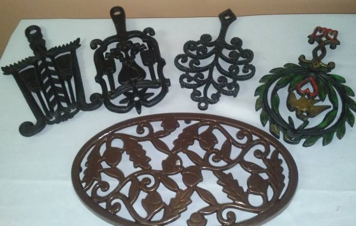 lot 103 image: Trivets, cast, some vintage.