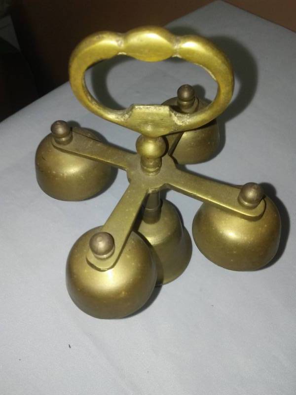 lot 107 image: Brass Bells, candle holders, incense burner.