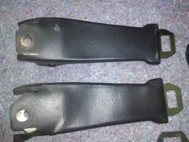 Front and rear black seat belts. All there and operable. Very good condition with age. Original