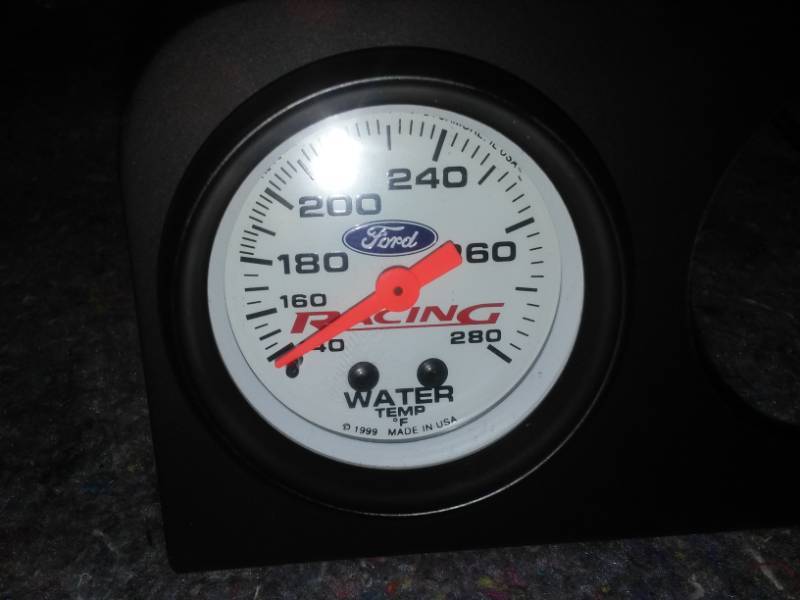 Ford brand oil and water gauges in a 3 slot bezel.