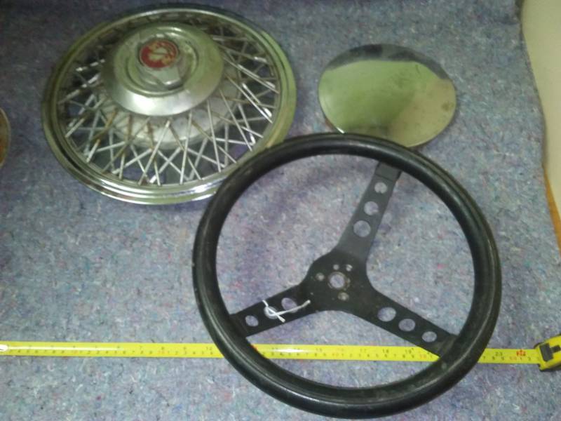 2 hubcaps and a steering wheel