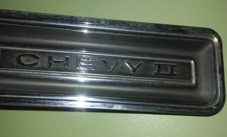 Chevy II Nova 1964 Rear Valance Bumper trunk emblem.