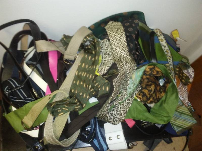 lot 223 image: Dozens of ties and belts.