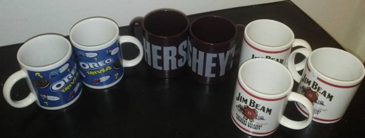 lot 234 image: 7 mugs - 3 Jim Beam, 2 Hersheys, 2 Oreo - all nice.