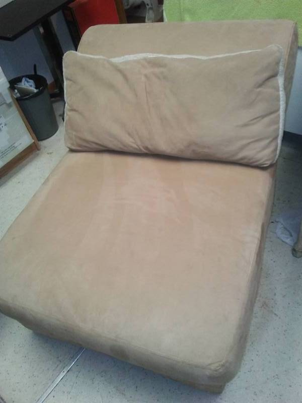 lot 270 image: Armless lounging chair with pillow.