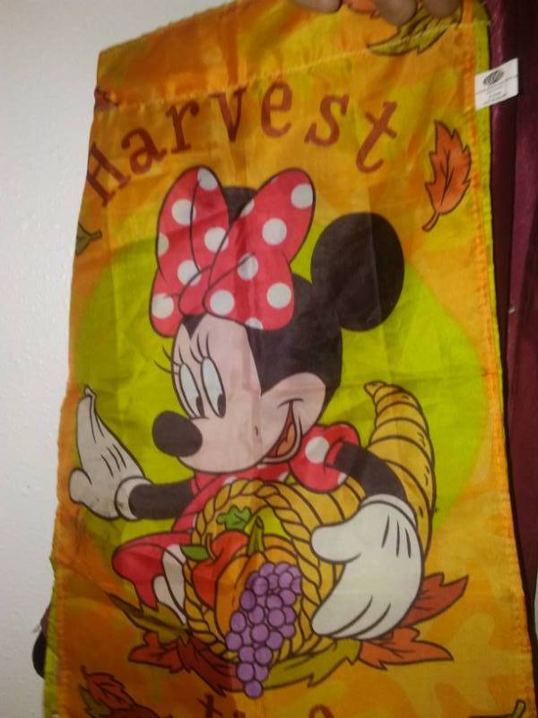 lot 309 image: Tote and cover full of garden banners and flags.