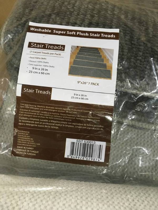 lot 97 image: Ottomanson Softy Collection Gray 9 in. x 26 in. Rubber Back Stair Tread Cover (Set of 7) not used