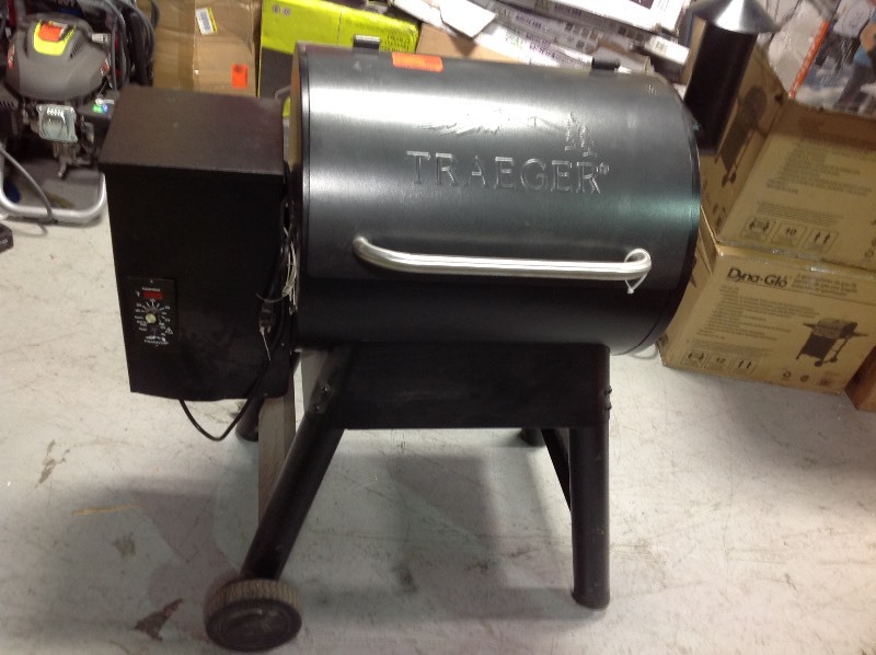 lot 105 image: Traeger Eastwood 22 Wood Pellet Grill and Smoker in Silver Vein Model # TFB42DVBO not used whit damage please review photos