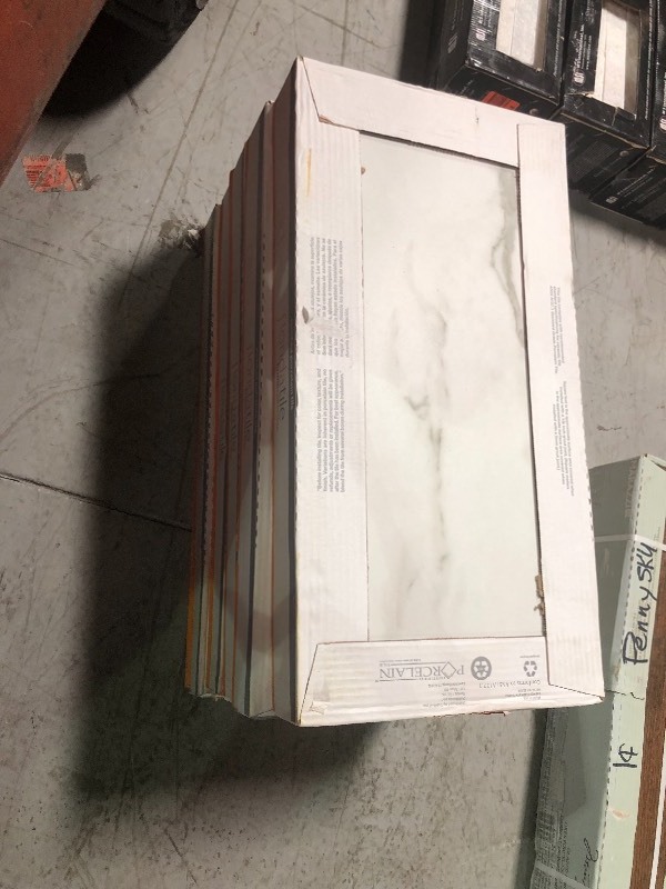 lot 122 image: Florida Tile Home Collection Michelangelo Calacatta Rectified 12 in. x 24 in. Porcelain Floor and Wall Tile (13.3 sq. ft. case) 5 cases not used