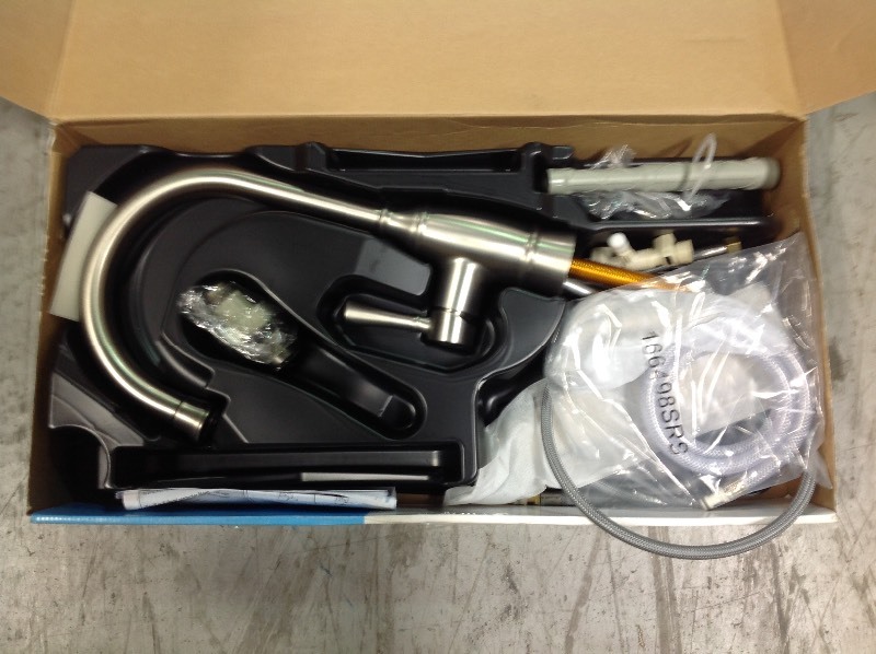 lot 107 image: MOEN Noell Single-Handle Standard Kitchen Faucet with Side Sprayer in Spot Resist Stainless in good conditions