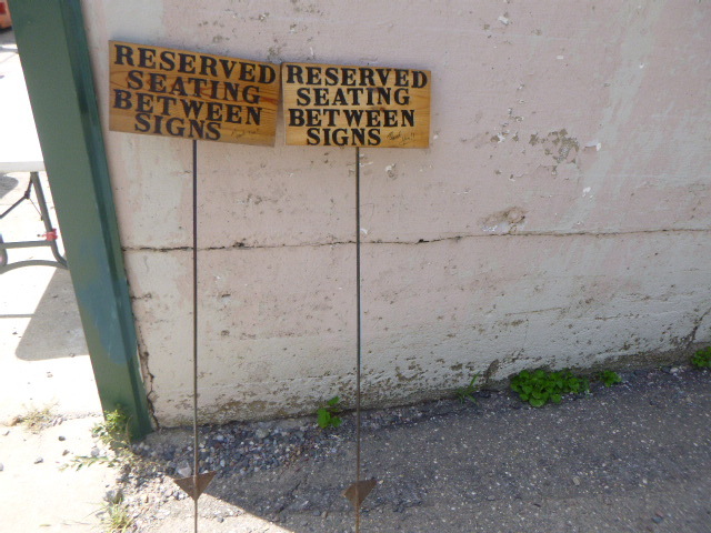 lot 108 image: 2 Reserved Seating Between Signs Signs
