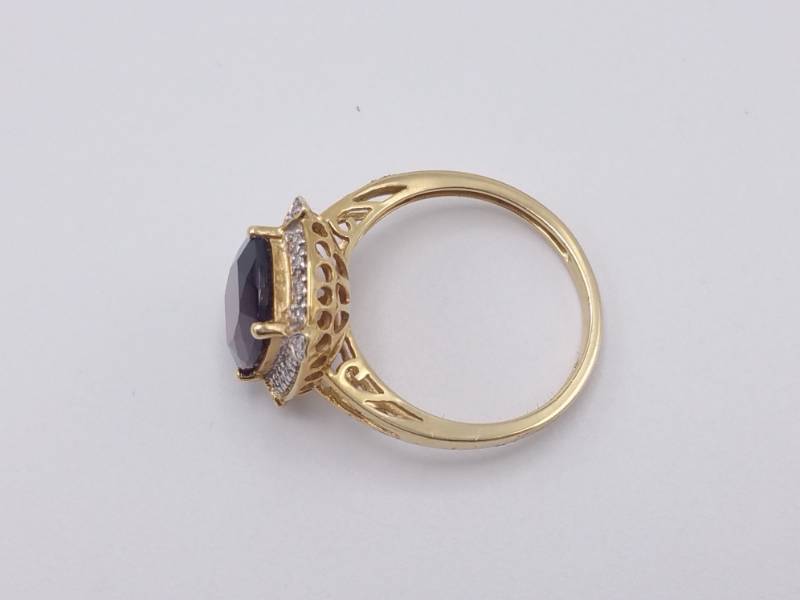 lot 41 image: 12 Carat Deep, Rich Garnet Surrounded in White Diamonds Estate Ring in 14k Yellow Gold