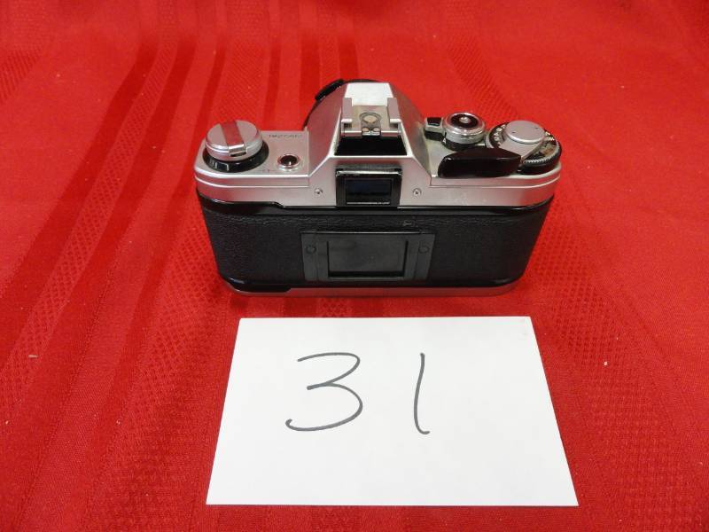 lot 31 image: Cannon AE-1 35 MM Camera with 11.8 50 MM Lens